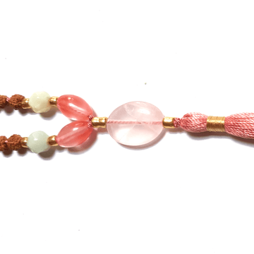 Close up of handmade Tourmalinated Quartz, Rudraksha, Rose Quartz and Amazonite Mala necklace Rose Quartz guru bead